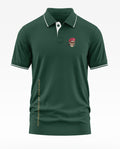 Green men's polo t-shirt with skull in beret patch and 'Conqueror of Enemies' text on side