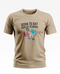 Beige men's T-shirt with 'Born to Bat Forced to Work' slogan and cricket-themed office graphic