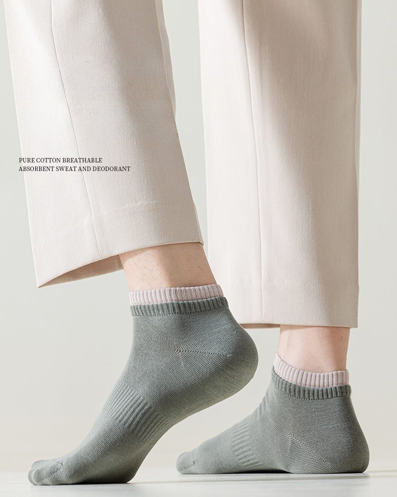 Men wearing light green ankle socks made from breathable cotton, paired with beige trousers.