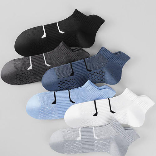 Set of five men's ankle socks in black, grey, blue, light blue, and white with hexagon grip pattern