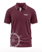 Maroon men's polo t-shirt with nautical wheel graphic and 'Nautical Pride' text on chest