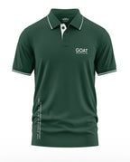 Dark green men's polo t-shirt with white 'GOAT' text, short sleeves, and white collar trim