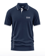Navy blue men's polo t-shirt with white GOAT text, short sleeves, and white collar trim.