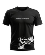 Black t-shirt with 'Be Kind To Animals' text and white graphic of puppy touching a human hand